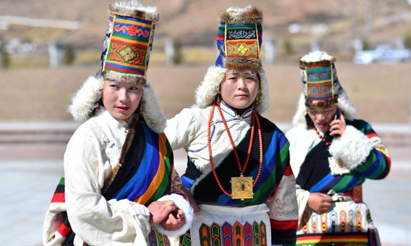 Women dressed in traditional costumes celebrate the Tibetan New Year in Damxung County of Lhasa, southwest China's Tibet Autonomous Region, Feb. 12, 2021. The Tibetan New Year coincided with the Spring Festival this year. (Xinhua/Chogo) 