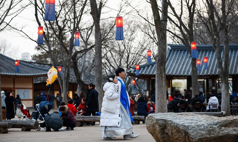 Tourists dressed in traditional costume visit a folklore-themed village in Yongin, South Korea, Feb. 5, 2019. (Xinhua/Wang Jingqiang)