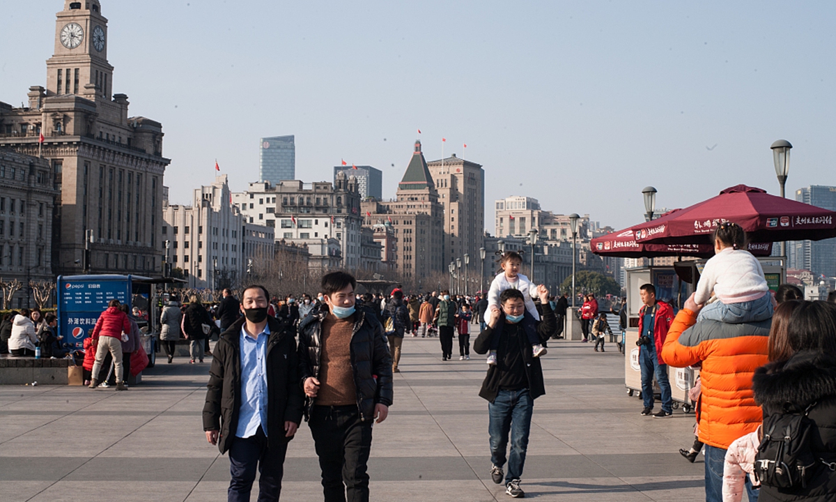 Tourists visit the Bund during the Lunar New Year holiday in east China's Shanghai, Feb. 16, 2021. Photo:VCG