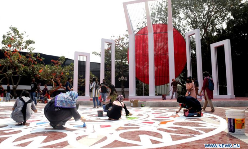 Artists paint in front of language martyrs' memorial monument in Dhaka ...
