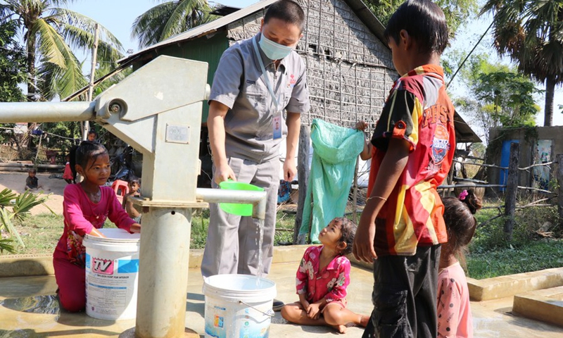 A Chinese engineer examines a new well constructed under the Phase II of China-aided rural water supply and rural road projects in Cambodia in Kampong Speu Province of Cambodia, Jan. 15, 2021.(Photo: Xinhua)