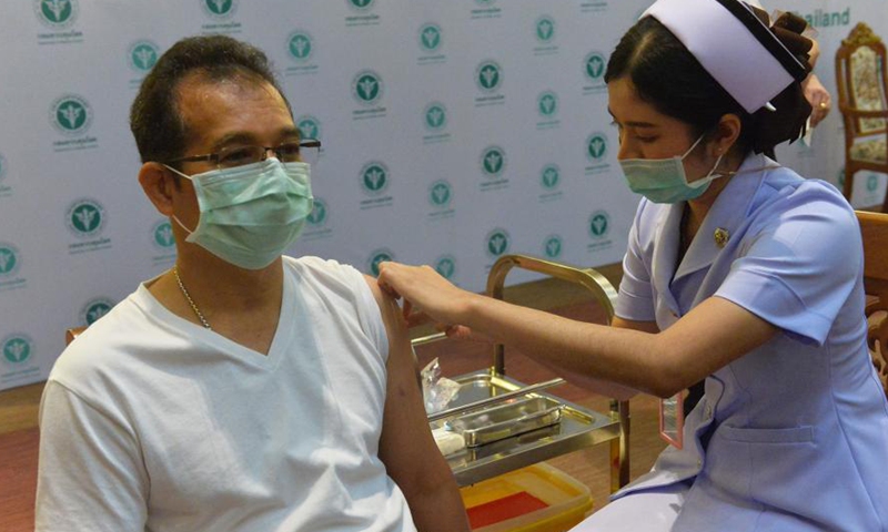 A man receives a shot of COVID-19 vaccine from China's Sinovac in Bangkok, Thailand, Feb. 28, 2021. Thailand on Sunday started its COVID-19 vaccination roll-out, with the first shot, using China's Sinovac vaccine, going to Deputy Prime Minister and Public Health Minister Anutin Charnvirakul.Photo:Xinhua