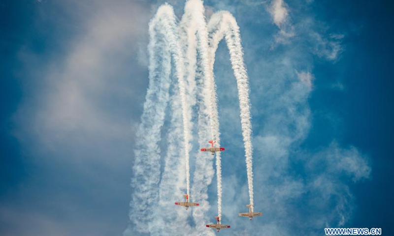 Airplanes perform during the Wings Over Wairarapa airshow at the Hood Aerodrome in Masterton, New Zealand, Feb. 27, 2021. Over 15,000 people gathered and crowded on the side of the airstrip of Hood Aerodrome in Masterton, New Zealand on Saturday, to watch the biennial Wings Over Wairarapa airshow. Wings Over Wairarapa 2021 began on Friday and will run for three days. It featured over 70 aircraft including vintage, military, New Zealand Defence Force, jets, helicopters, aerobatic displays, and skydiving.(Photo: Xinhua)