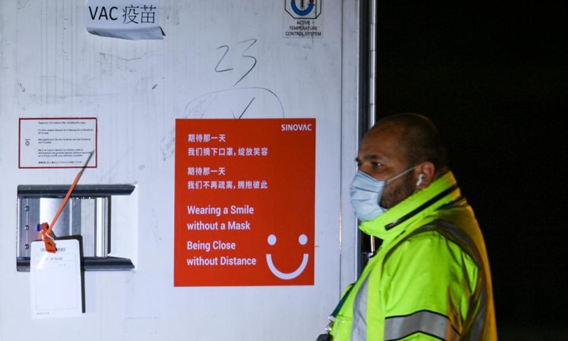 A staff member unloads a temperature-controlled cargo container with COVID-19 vaccines from Chinese company Sinovac at Mexico International Airport in Mexico City, Mexico, Feb. 27, 2021. The second shipment of COVID-19 vaccines from Chinese company Sinovac arrived in Mexico City on Saturday.Photo:Xinhua