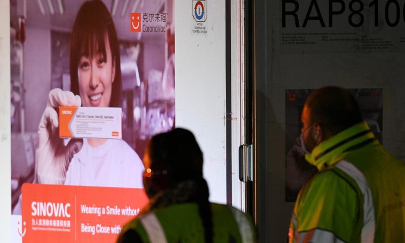 Staff members unload a temperature-controlled cargo container with COVID-19 vaccines from Chinese company Sinovac at Mexico International Airport in Mexico City, Mexico, Feb. 27, 2021. The second shipment of COVID-19 vaccines from Chinese company Sinovac arrived in Mexico City on Saturday.Photo:Xinhua