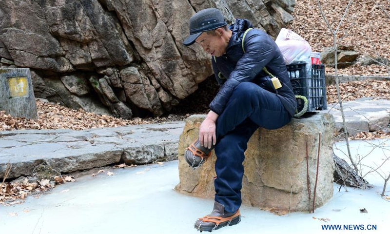 Rong Ximin patrols at Tuoliang National Nature Reserve, north China's Hebei Province, Feb. 28, 2021. Rong Ximin, a ranger of Yunding Grassland in Tuoliang National Nature Reserve, came to work in the reserve with his wife Shi Shufang in 2009. Photo:Xinhua