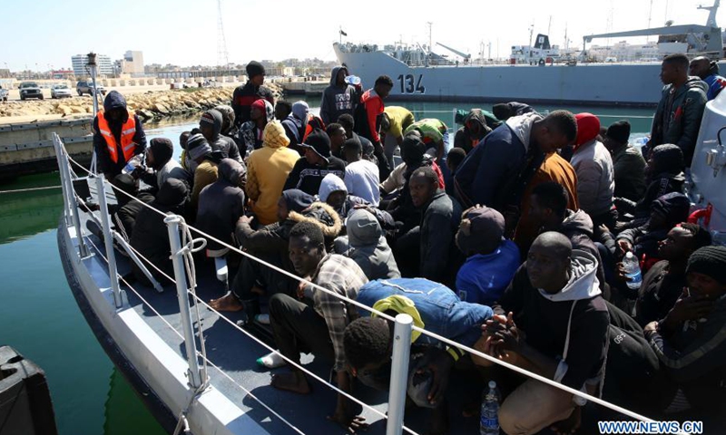 Illegal immigrants are seen on the deck of the Libyan Coast Guard's ship in Tripoli, Libya, on Feb. 28, 2021. A total of 181 illegal immigrants were rescued on Sunday by the Libyan Coast Guard off the country's western coast.(Photo: Xinhua)