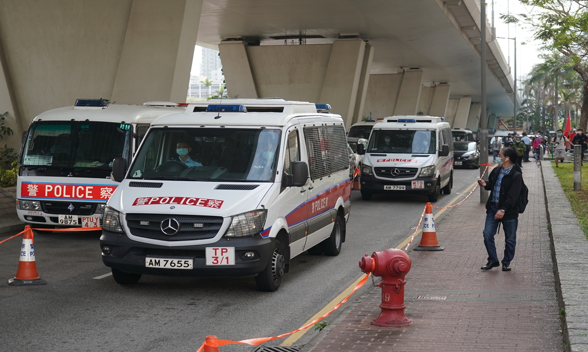 Police vans carrying 47 people in Hong Kong, arrested in January for conspiring to subvert state power, arrive at West Kowloon Magistrates' Courts on Monday. The defendants aged between 23 and 64 faced the court the same day. Photo: VCG