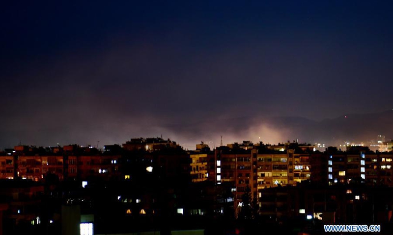 Smoke rises following an Israeli missile attack in Damascus, Syria, on Feb. 28, 2021. A fresh Israeli missile attack targeted positions in the vicinity of Damascus on Sunday night, state TV reported.(Photo: Xinhua)