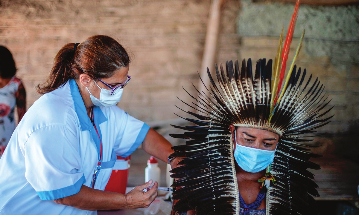 Guarani indigenous chief Jurema Nunes, receives a CoronaVac vaccination shot during a COVID-19 vaccination campaign in Marica, Brazil, on January 20. Photo: VCG