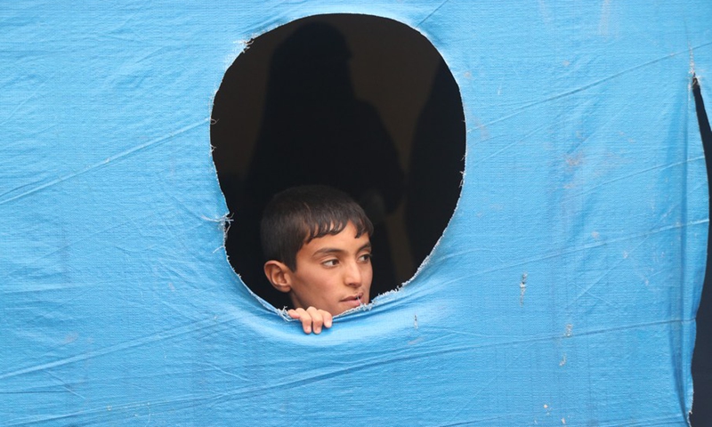 A displaced boy is seen at the al-Hol camp run by the Kurdish militias in the northeastern province of Hasakah, Syria, Nov. 16, 2020. (Photo: Xinhua)