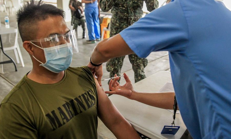 A soldier receives a dose of China's Sinovac COVID-19 vaccine at the Marikina Sports Center in Marikina City, the Philippines, March 2, 2021. The Philippines has begun their COVID-19 vaccination campaign after the country received the shipment of the Sinovac vaccine CoronaVac from China.Photo:Xinhua