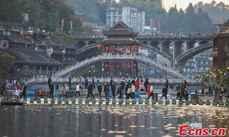 Photo taken on Feb. 16, 2021 shows tourists visit Fenghuang Town in Xiangxi Tujia and Miao autonomous prefecture, Central China's Hunan Province.Photo:China News Service