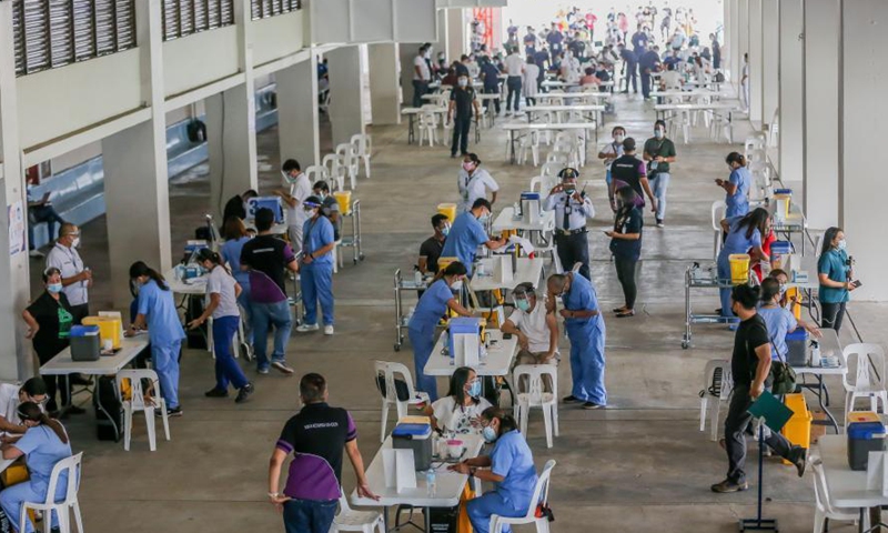 Photo taken on March 2, 2021 shows people receiving China's Sinovac COVID-19 vaccines at the Marikina Sports Center in Marikina City, the Philippines. The Philippines has begun their COVID-19 vaccination campaign after the country received the shipment of the Sinovac vaccine CoronaVac from China.Photo:Xinhua