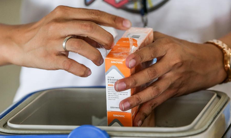 A nurse prepares China's Sinovac COVID-19 vaccines at the Marikina Sports Center in Marikina City, the Philippines, March 2, 2021. The Philippines has begun their COVID-19 vaccination campaign after the country received the shipment of the Sinovac vaccine CoronaVac from China.Photo:Xinhua