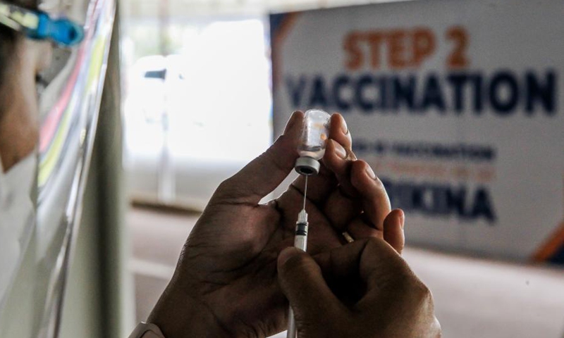A nurse prepares a dose of China's Sinovac COVID-19 vaccine at the Marikina Sports Center in Marikina City, the Philippines, March 2, 2021. The Philippines has begun their COVID-19 vaccination campaign after the country received the shipment of the Sinovac vaccine CoronaVac from China.Photo:Xinhua