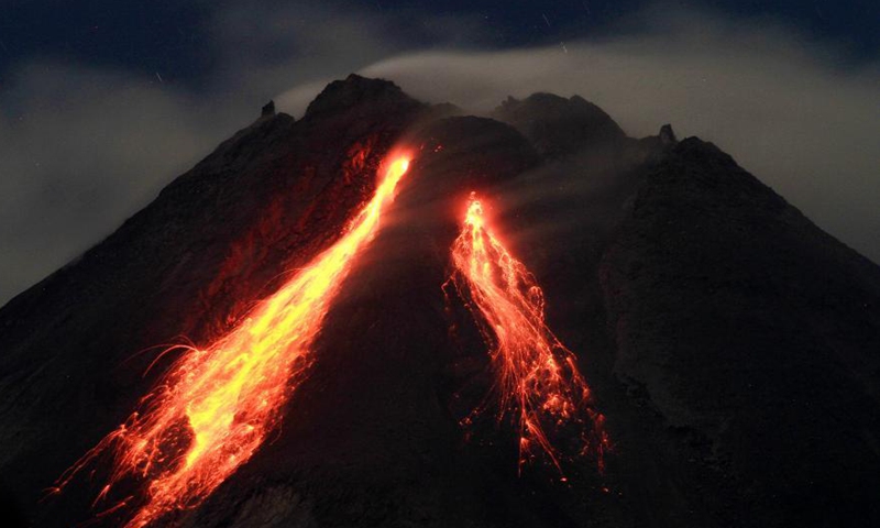 Photo taken on March 2, 2021 shows volcanic materials spewing from Mount Merapi, viewed from Turi, Sleman district in Yogyakarta, Indonesia.Photo:Xinhua