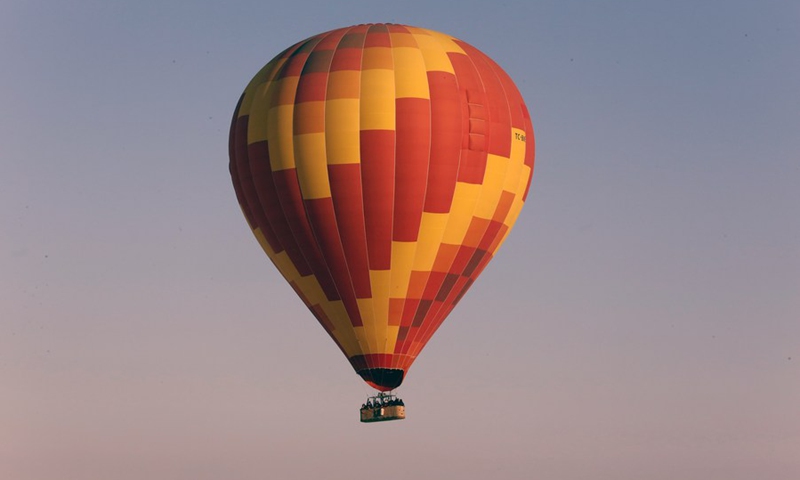 A hot-air balloon flies in the sky over Cappadocia, Turkey, on Feb. 20, 2021.(Photo: Xinhua)