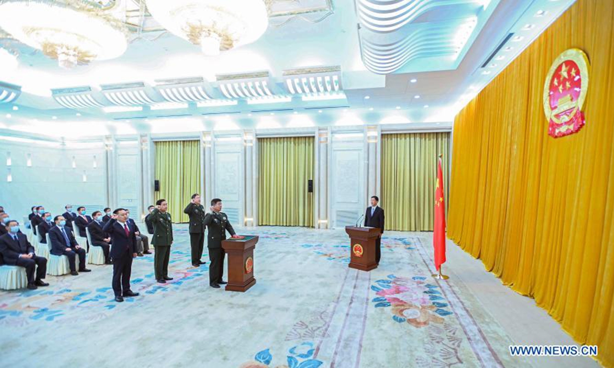 Cao Jianming, vice chairman of the Standing Committee of the National People's Congress (NPC), presides over an oath-taking ceremony held by the 13th NPC Standing Committee to pledge allegiance to the Constitution at the Great Hall of the People in Beijing, capital of China, Feb. 28, 2021. (Xinhua/Li Tao) 