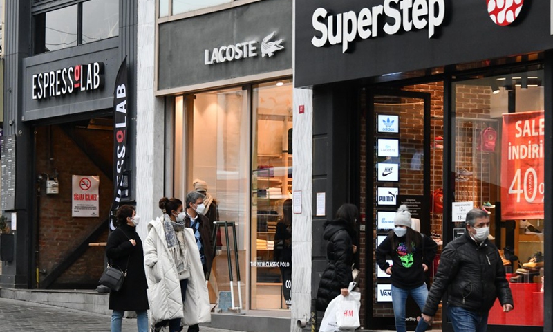 People walk past stores in Istanbul, Turkey, Feb. 25, 2021.(Photo: Xinhua)
