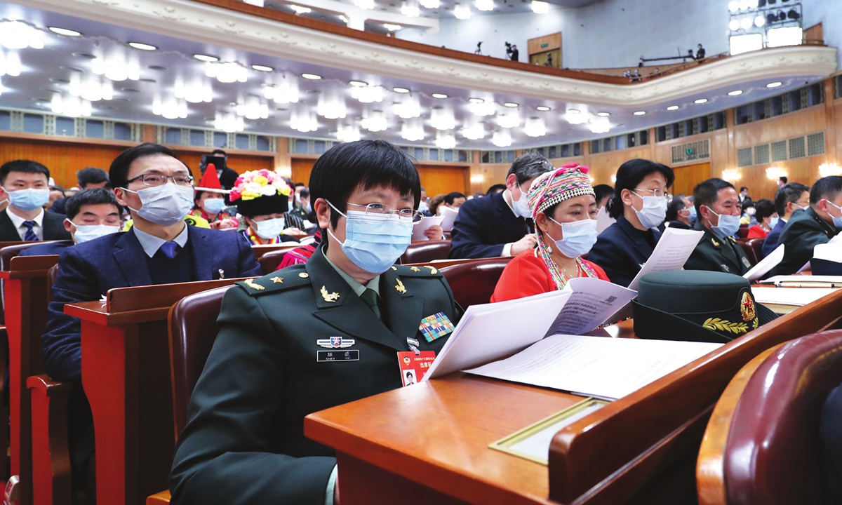 Chen Wei (front), a member of the 13th National Committee of the Chinese People's Political Consultative Conference (CPPCC) and a key researcher of a Chinese adenovirus vaccine for the COVID-19, attends this year's annual CPPCC session, which kicked off on Thursday. Photo: Xinhua