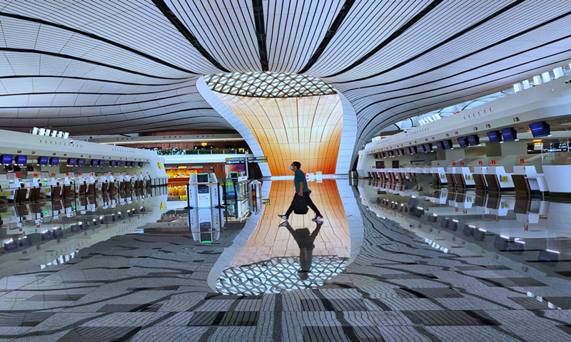 A passenger walks at Beijing Daxing International Airport on October 14, 2020. Photo: VCG