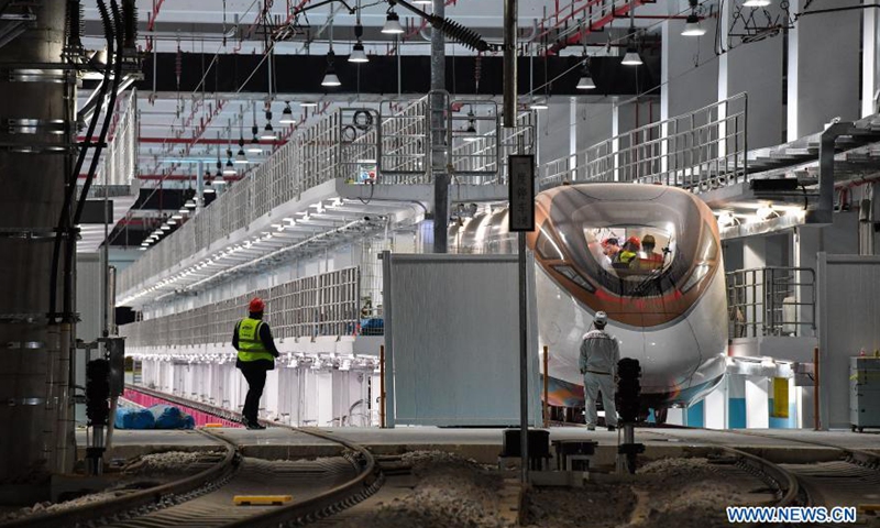 A train of the Guangzhou Metro Line 18 is seen at the Longzhen train depot for hot-running test in Guangzhou, south China's Guangdong Province, March 3, 2021. The electric train, with a maximum designed speed of 160 km per hour, carried out the first hot-running test in the small hours of Thursday morning, in order to conduct a comprehensive inspection of the subway power supply, signal, communication, line, and electromechanical system of the line.Photo:Xinhua