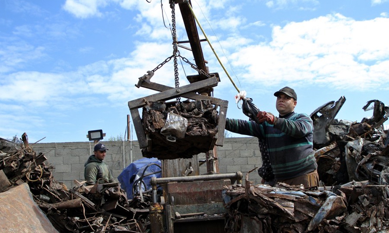 Palestinian workers work at a scrap metal recycling factory in the al-Zaitoun neighborhood in the east of Gaza City, on Feb. 20, 2021. The metal waste will be exported to Israel after a 15-year ban.(Photo: Xinhua)