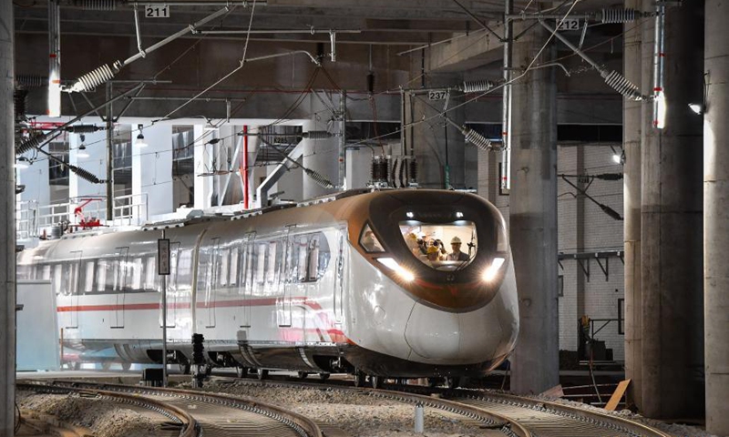 A train of the Guangzhou Metro Line 18 pulls out for hot-running test in Guangzhou, south China's Guangdong Province, March 3, 2021. The electric train, with a maximum designed speed of 160 km per hour, carried out the first hot-running test in the small hours of Thursday morning, in order to conduct a comprehensive inspection of the subway power supply, signal, communication, line, and electromechanical system of the line.Photo:Xinhua