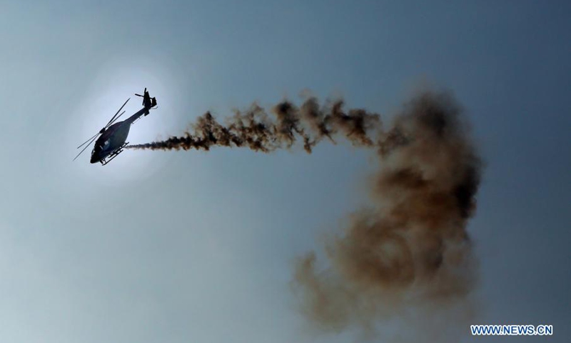 A helicopter performs during an air show to mark the 70th anniversary of the Sri Lanka Air Force in Colombo, Sri Lanka, on March 3, 2021.(Photo: Xinhua)