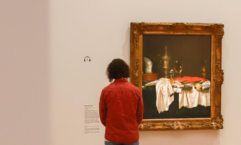 A visitor views a painting at the media preview of an exhibition in Canberra, Australia, on March 3, 2021. An exhibition with 61 paintings from the National Gallery London spanning nearly 500 years will start on Friday. It brought together works of 56 of European history's greatest artists including Botticelli, Titian, Velazquez, Rembrandt, Vermeer, Goya, Van Dyck, Canaletto, Turner, Renoir, Cezanne, Monet and Gauguin, and will run until June 14.Photo:Xinhua
