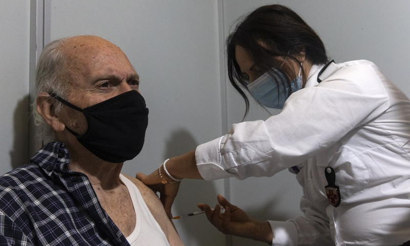 A man receives COVID-19 vaccine at a new COVID-19 vaccination center, in Athens, Greece, Feb. 15, 2021.(Photo: Xinhua)