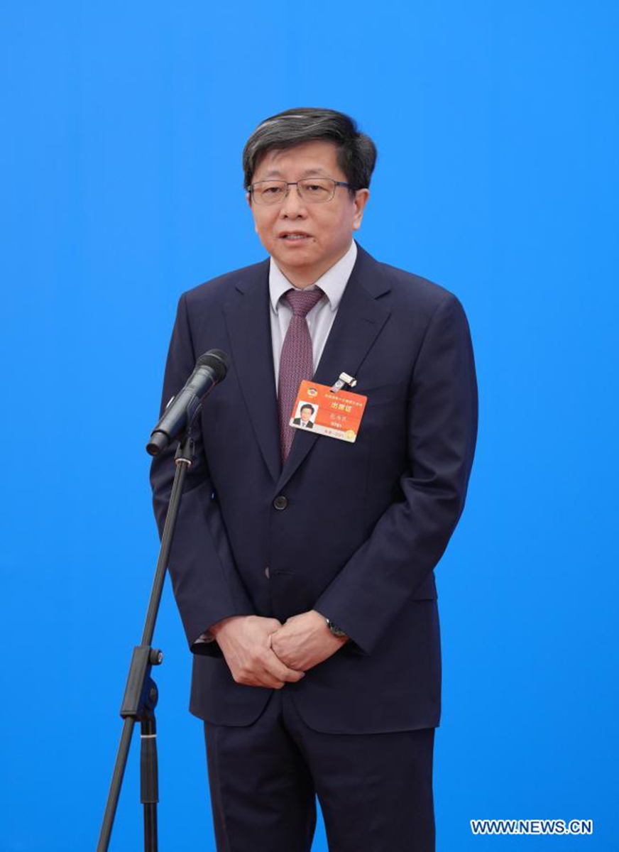 Bao Weimin, a member of the 13th National Committee of the Chinese People's Political Consultative Conference (CPPCC), is interviewed via video link ahead of the opening of the fourth session of the 13th CPPCC National Committee at the Great Hall of the People in Beijing, capital of China, March 4, 2021. (Xinhua/Li He)