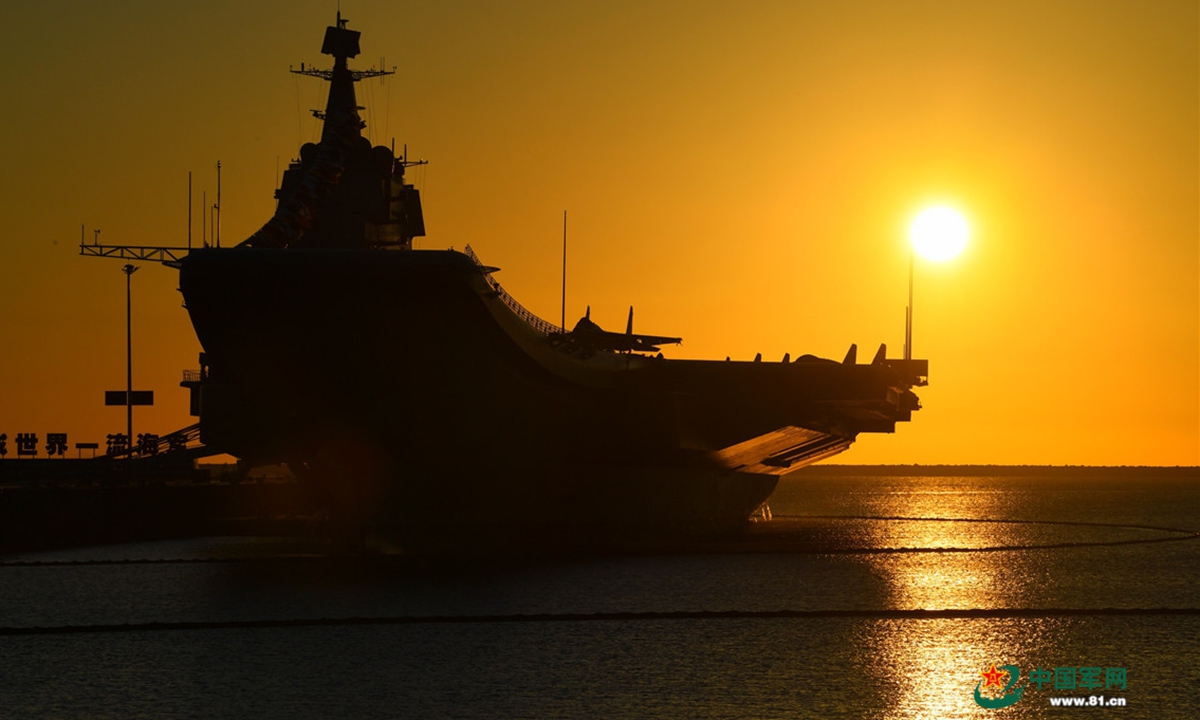 The picture shows aircraft carrier <em>Shandong</em> berths at a naval port in Sanya. China's first domestically-made aircraft carrier <em>Shandong</em> (Hull 17) was officially commissioned to the PLA Navy at a military port in Sanya, South China's <em>Hainan</em> Province, on the afternoon of December 17, 2019, making China one of the few countries in the world that have multiple carriers. Photo:China Military