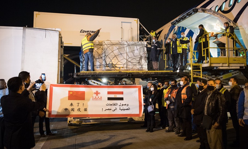 Workers upload a batch of China's Sinopharm COVID-19 vaccines onto a truck at the Cairo International Airport, Egypt, Feb. 23, 2021.(Photo: Xinhua)