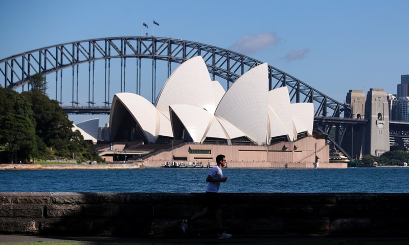A man runs in a park opposite the Sydney Opera House in Sydney, Australia, on Feb. 26, 2021.(Photo: Xinhua)