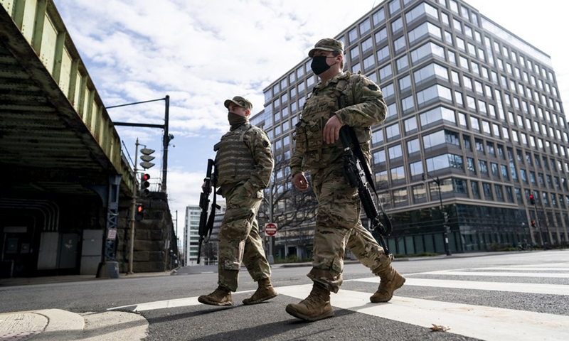 Security staff are seen near the U.S. Capitol building in Washington, D.C., the United States, Jan. 17, 2021.(Photo: Xinhua)