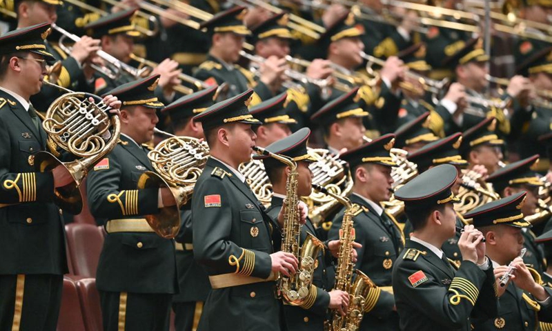 The military band of the Chinese People's Liberation Army performs during the opening meeting of the fourth session of the 13th National Committee of the Chinese People's Political Consultative Conference (CPPCC) at the Great Hall of the People in Beijing, capital of China, March 4, 2021. (Xinhua/Li Xin)



