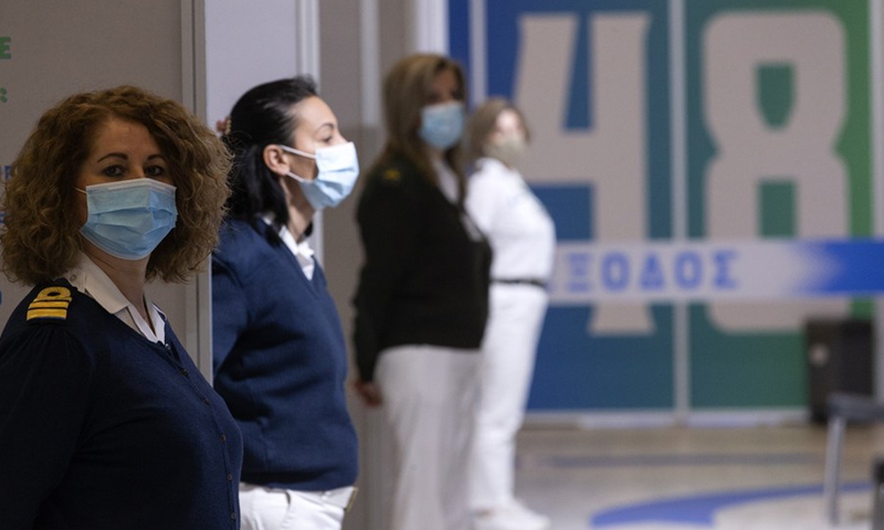 Army medical workers are seen at a corridor of a new COVID-19 vaccination center in Athens, Greece, Feb. 13, 2021. (Photo: Xinhua)