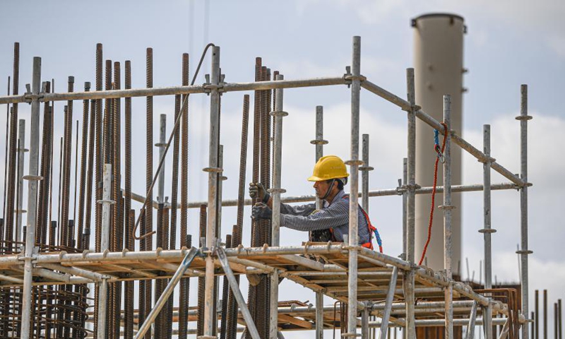 A worker is busy at the construction site of a passenger transportation station at the Xinhai Port in Haikou, south China's Hainan Province, March 5, 2021. The completion of this project will help improve the service level of the Xinhai Port in Haikou. Photo: Xinhua