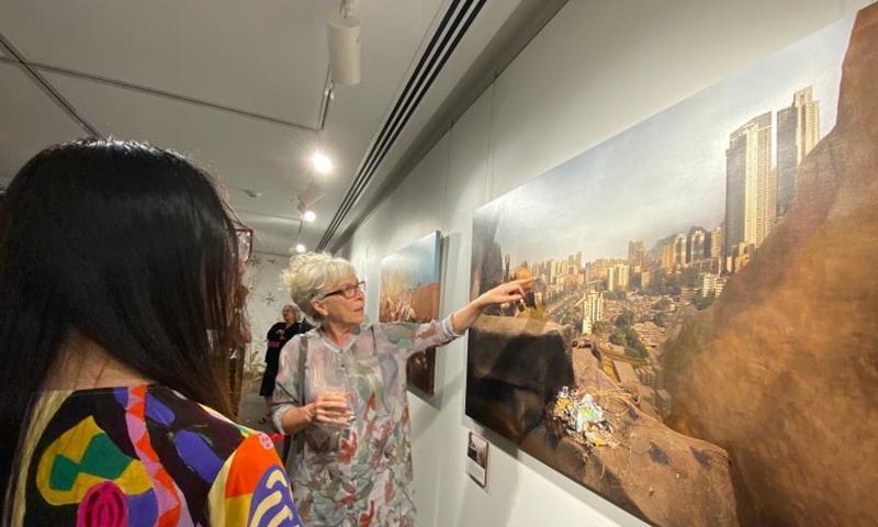 Australian artist Anne Zahalka introduces her artwork during an art exhibition held by the China Cultural Center in Sydney, Australia, March 4, 2021. Photo: Xinhua