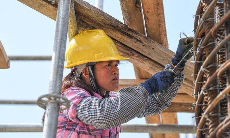 A worker is busy at the construction site of a passenger transportation station at the Xinhai Port in Haikou, south China's Hainan Province, March 5, 2021. The completion of this project will help improve the service level of the Xinhai Port in Haikou. Photo: Xinhua