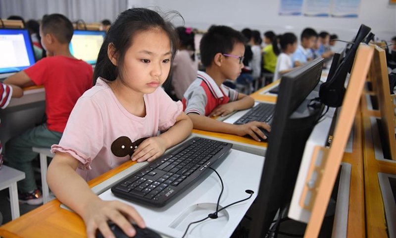 Students have computer class at the Jinzhai County primary school in Jinzhai, East China's Anhui Province, on September 3, 2019. Photo: Xinhua