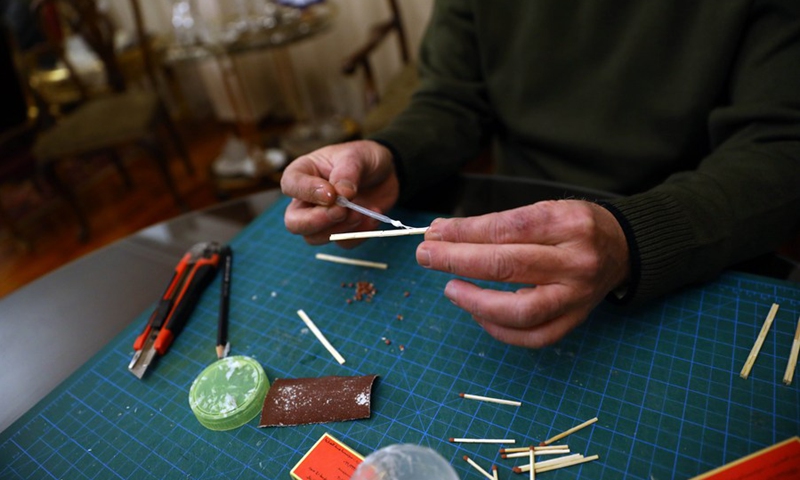 Ahmed Hassan builds the replica of Temple of Heaven with matchsticks in Cairo, Egypt, on Feb. 26, 2021.(Photo: Xinhua)
