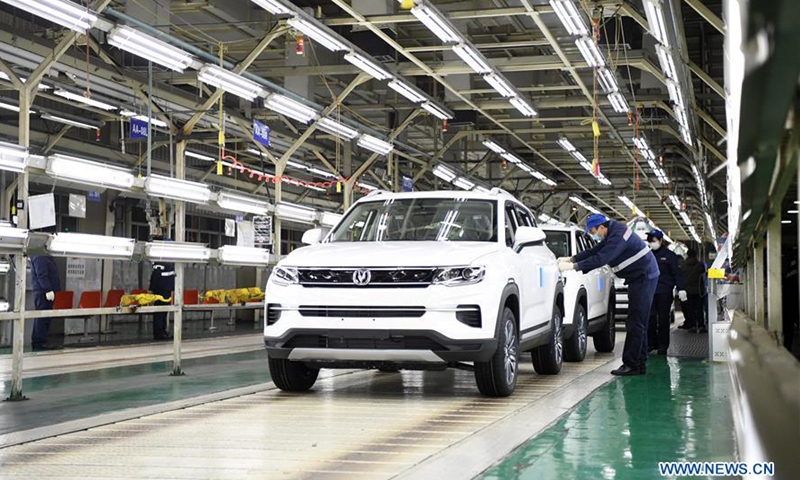 Staff members work at a production line of Yubei plant of Chongqing Changan Automobile Co., Ltd. in Chongqing, southwest China, Feb. 18, 2020.Photo:Xinhua