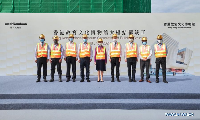 Chief Executive of the Hong Kong Special Administrative Region Carrie Lam (C), Chairman of West Kowloon Cultural District Authority Board Henry Tang(4th L) and Chairman of Hong Kong Palace Museum Limited Bernard Charnwut Chan (4th R) attend the completion ceremony of the main structure of the Hong Kong Palace Museum (HKPM) building in south China's Hong Kong, Nov. 18, 2020. (Xinhua/Wang Shen)