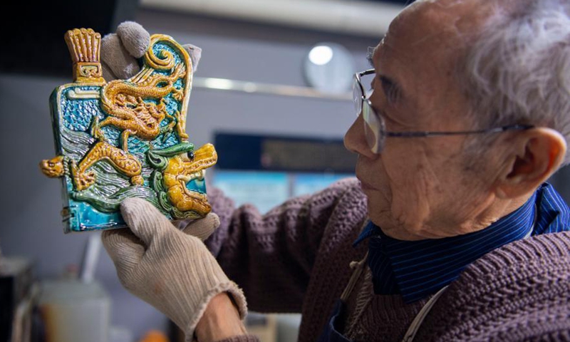 Ge Yuansheng is a representative inheritor of colored glaze firing skill, which was listed as national intangible cultural heritage in 2008. Colored glaze handicraft, with its gorgeous color and delicate shape, has been widely used in houses, palaces, temples and other architecture. Photo:Xinhua