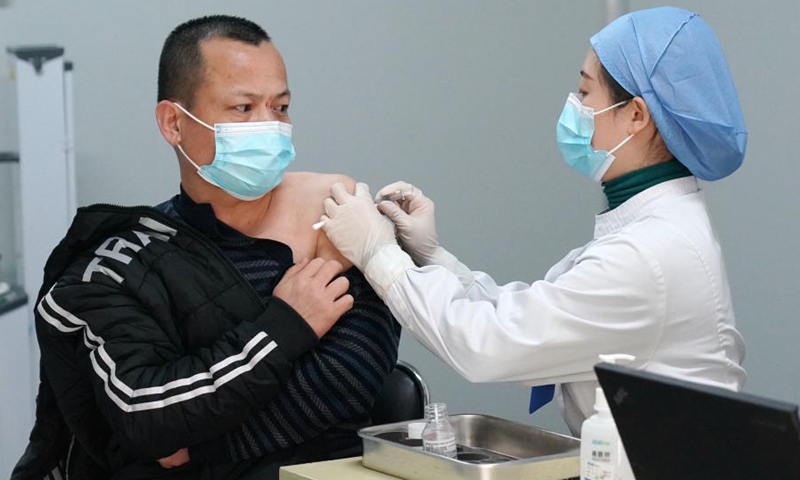 A medical worker inoculates a man with a COVID-19 vaccine at a vaccination site in Daxing District of Beijing, capital of China, Jan. 3, 2021. Beijing has started administering COVID-19 vaccines among specific groups of people with higher infection risks. Nine groups of people aged 18 to 59 will receive the vaccine before the Spring Festival of 2021, which falls on Feb. 12.(Photo: Xinhua)