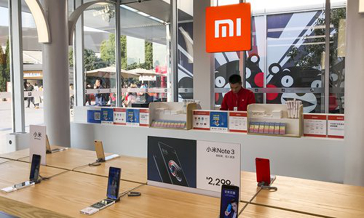 A Chinese employee at Xiaomi's Mi Home in Shanghai Photo: IC