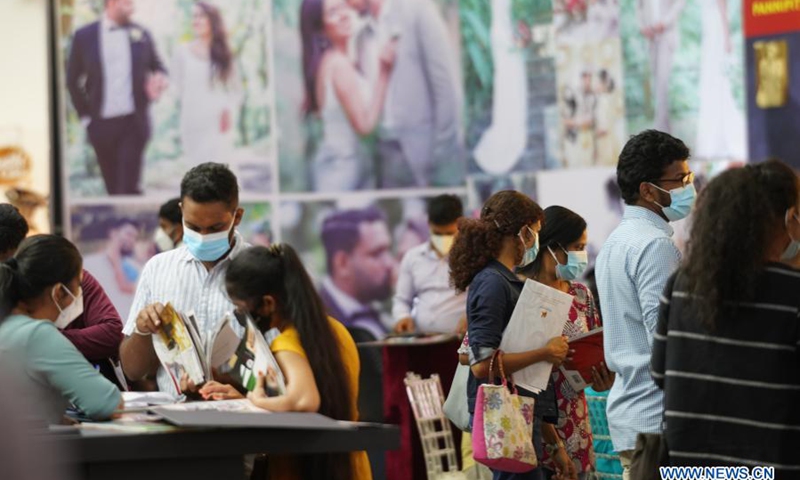 People wearing face masks visit a wedding show in Colombo, Sri Lanka, on March 7, 2021. The three-day exhibition which covers all areas of the bridal industry concluded here on Sunday.(Photo: Xinhua)